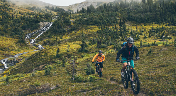 Two people cycling on a trail